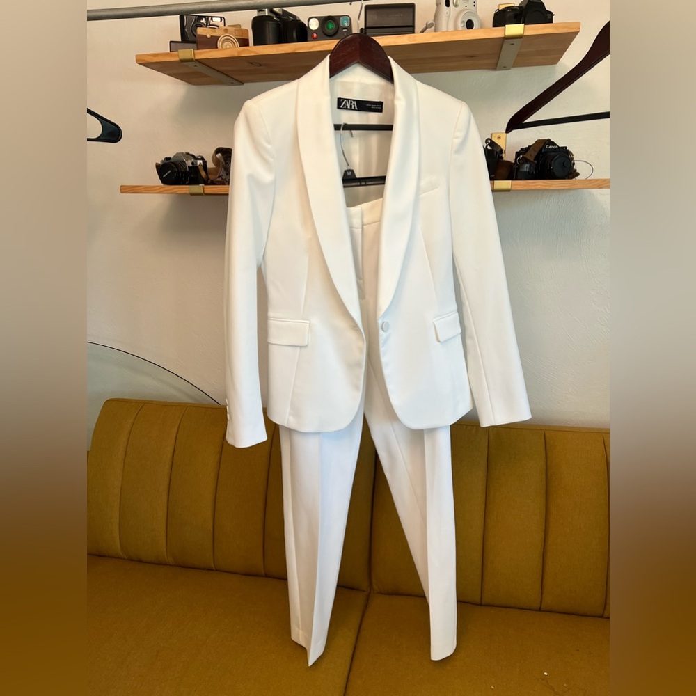 White pant suit with deep neckline